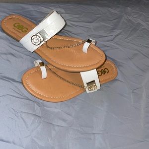 White & gold flip flops. Never worn. Excellent condition